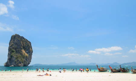 KRABI, THAILAND - APRIL 12, 2016 : Poda Island, white sandy beach with turquoise andaman sea water and long-tailed boat taxi in Krabi province, Thailand.のeditorial素材
