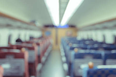 Abstract blurred Interior of a passenger car background. Travel concept with public train transport.の写真素材