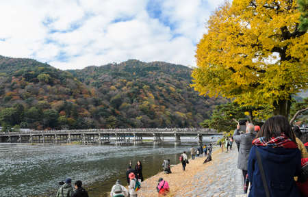 KYOTO, JAPAN -NOVEMBER 24, 2016: Togetsukyo bridge over Katsura river during autumn season in...