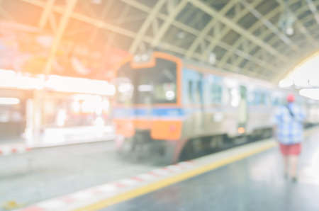 Railway platform with passenger train. Blurred train on railroad track.の写真素材