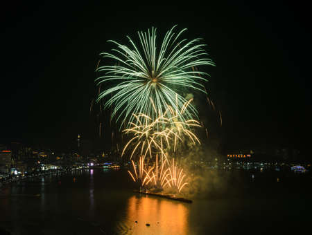 Beautiful firework on the sky at Pattaya coast with cityscape background, Thailandのeditorial素材