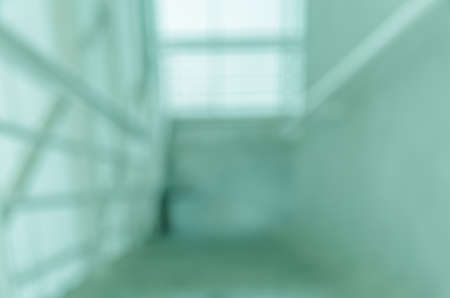 Blurred abstract background of stair hall with light and shadow. Green tone imageの写真素材