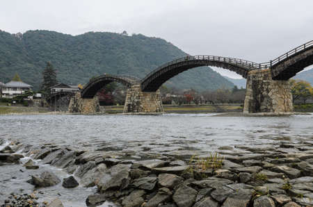 Kintai Bridge over Nishiki river in cloudy day, Iwakuni, Japanの写真素材