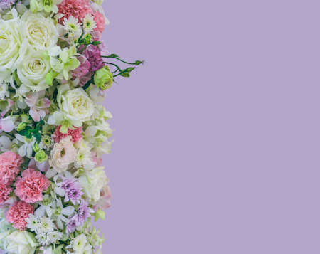Beautiful bouquet flowers of white Roses, pink Orchid, pink Carnation and white Chrysanthemum on violet color backgroundの写真素材