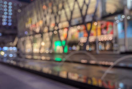 Blurred image of shopping mall with shining lights at nightの写真素材