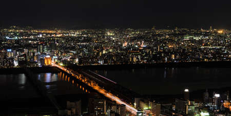 OSAKA, JAPAN - NOVEMBER 25, 2016 : Stunning night illumination view of Osaka commercial and business cityscape from Umeda Sky Building in Osaka, Japan. Osaka is the second largest metropolitan area in Japan.のeditorial素材