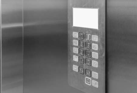 Elevator interior control panel with Braille dots buttons lift accessible to the blind