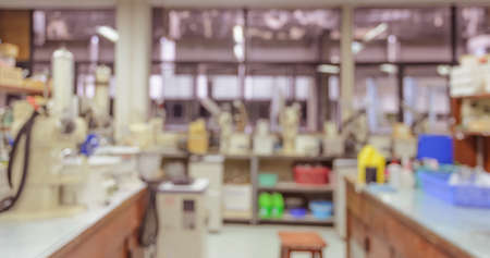 Blurred abstract background of workbench and equipment in chemistry laboratory. Scientific concept...