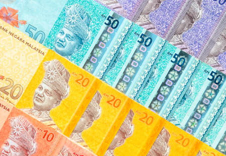 Malaysia currency of Malaysian ringgit banknotes background. Paper money of ten, twenty, fifty and...