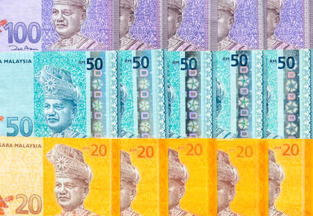 Malaysia currency of Malaysian ringgit banknotes background. Paper money of twenty, fifty and...