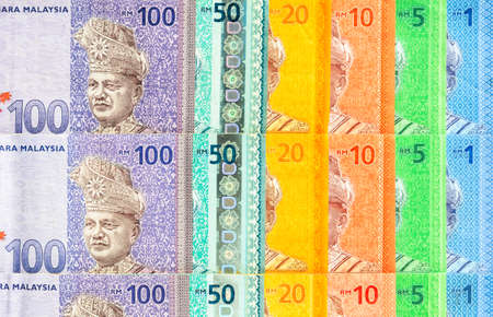 Malaysia currency of Malaysian ringgit banknotes background. Paper money of one, five, ten, twenty, fifty and hundred ringgit notes. Financial concept.の写真素材
