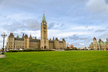 Ottawa, Canada - October 14, 2018 : Parliament Hill in Ottawa, Canada. Facade view of Centre Block and East Block of Canadian Parliamentary complex in autumnのeditorial素材