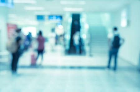 Abstract blur and defocused of airport terminal interior with travelers for backgroundの写真素材
