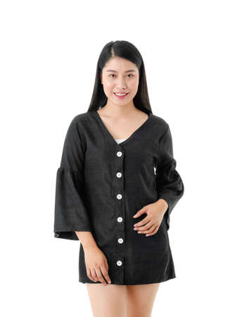 Young smiling woman casual style in black dress looking at the camera isolated on white backgroundの写真素材