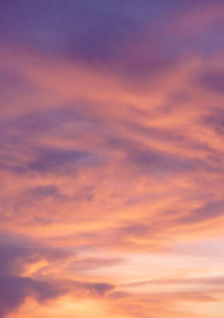Background of colorful dramatic sunset with twilight color sky and cloudsの写真素材