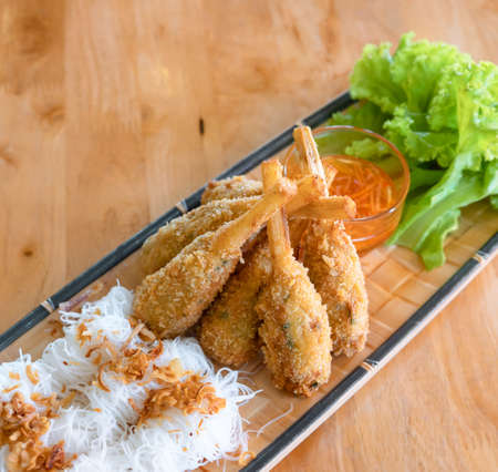 Fried Shrimp with Sugar Cane (Chao tom) served with rice vermicelli and sweet sauce, Vietnamese foodの写真素材