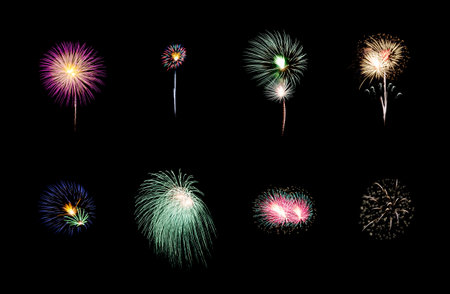 Collection of colorful festive eight fireworks exploding over night sky, isolated on black backgroundの写真素材
