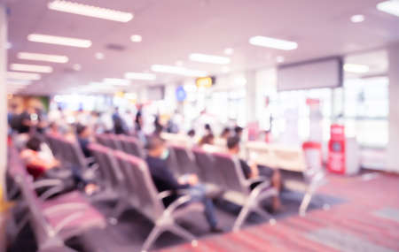 Abstract blur and defocused airport terminal interior with travelers for background. Waiting roomの写真素材