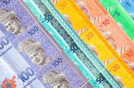 Malaysia currency of Malaysian ringgit banknotes background. Paper money of one, five, ten, twenty, fifty and hundred ringgit notes. Financial concept.の写真素材