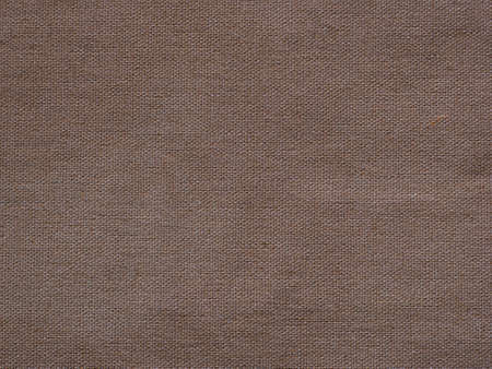 Brown woven cotton fabric texture backgroundの写真素材