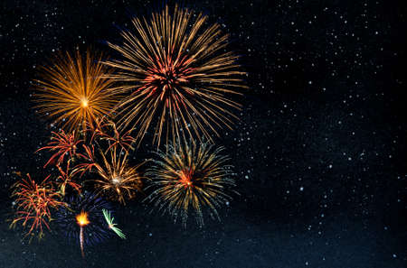 Bright sparkle lights in starry night sky. Firework banner for celebration and holiday backgroundの写真素材
