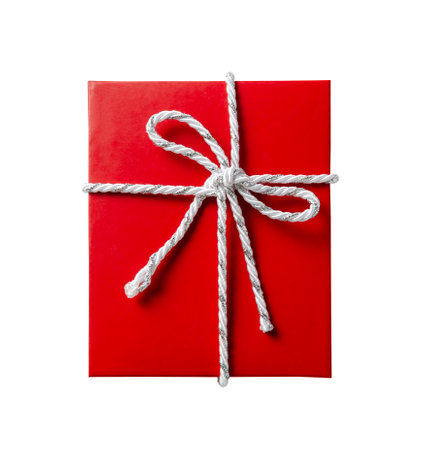 Red gift box with white and silver cord rope ribbon isolated on white background, top view.の写真素材
