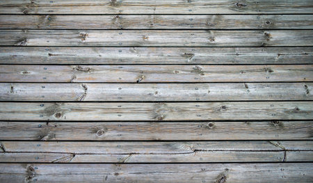 Brown weathered wood plank wall texture background with natural patternsの写真素材