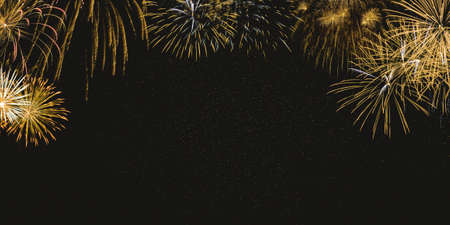 Gold fireworks on night sky background with stars. New year celebration concept