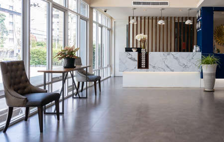 Interior of a hotel lobby with Check-in counter and waiting areaの写真素材