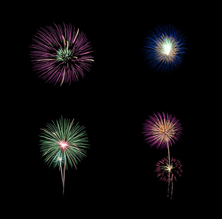 Collection of colorful festive four  fireworks exploding over night sky, isolated on black backgroundの写真素材