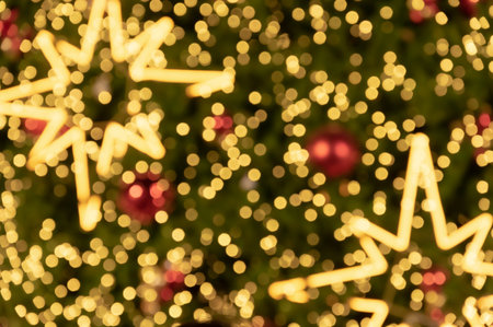 Blur bokeh background of star shaped Christmas tree lights