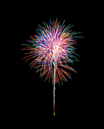 Beautiful colorful fireworks exploding in the night sky, isolated on black background. New year and anniversary concept.の写真素材