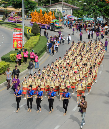 SUPHANBURI, THAILAND - JULY 12, 2014: Thai dancing parade of candle festival procession on The Buddhist Lent Day in Suphanburi, Thailand.のeditorial素材