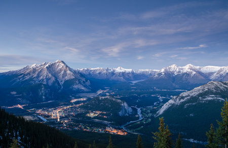 Panoramic sunset view of Bow Valley and valley town of Banff surrounded by Canadian Rocky mountains in at Banff National Park in Alberta, Canada. View from Banff Gondola Sulphur Moutainの写真素材