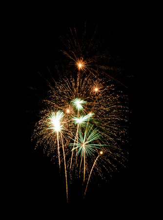 Yellow fireworks exploding on black sky. Celebration and anniversary conceptの写真素材