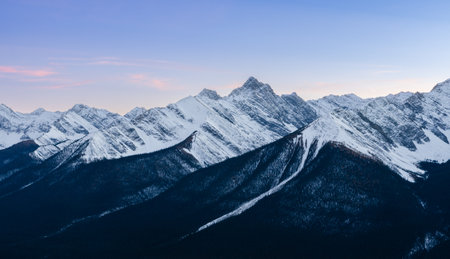 Stunning sunset of snow capped Canadian Rocky mountains at Banff National Park in Alberta, Canada. View from Banff Gondola Sulphur Moutain.の写真素材