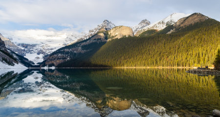 Morning winter sunshine view of Lake Louise with Mount St. Piran reflection in Banff National Park, Alberta, Canadaの写真素材
