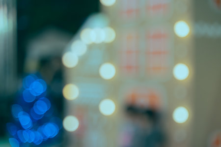 Blurry colorful Christmas bokeh lights festive backgroundの写真素材