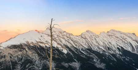 Stunning Canadian Rocky mountains twilight scene of snow capped mountain at Banff National Park in...