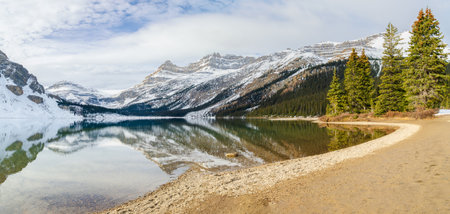 Panoramic winter view of Bow Lake with Rocky mountain reflection at icefields Parkway in Banff National Park, Alberta, canadaの写真素材