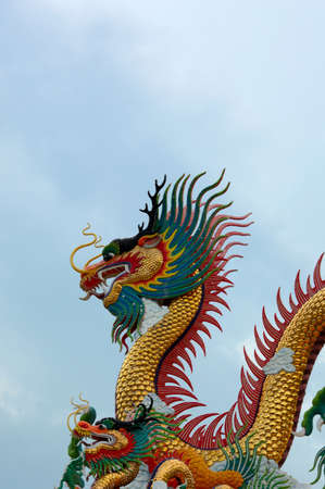 Golden dragon statue in NaKhon Sawan Park, Nakhon Sawan Province, Thailandの写真素材