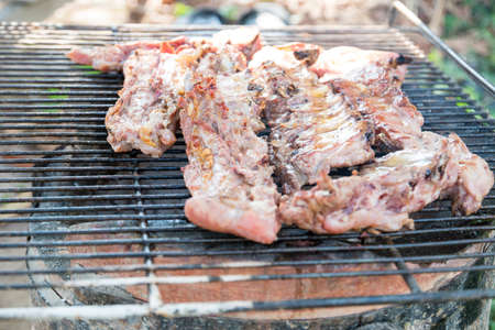 Pork rips grilled on the charcoal stoveの写真素材
