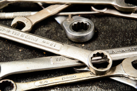 Close up shot wrenches on a metal background