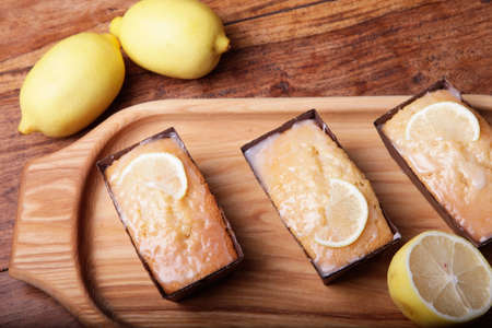lemon cake portions on the wooden trayの写真素材