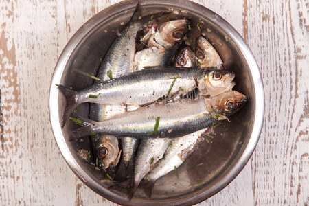 prepared sardines for cooking in the metal bowlの写真素材