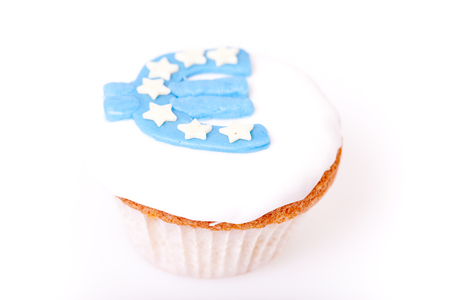 euro sign on cup cake on white の写真素材