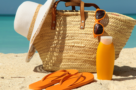 sun protection items on the sunny beachの写真素材