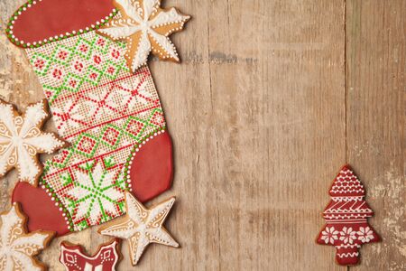 Homemade various christmas gingerbread cookies on wooden background with copy spaceの写真素材