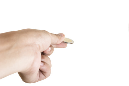 Hand and falling coins  on white backgroundの写真素材