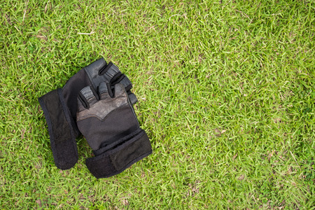 Top - view water bottle and towel with grass background.の写真素材